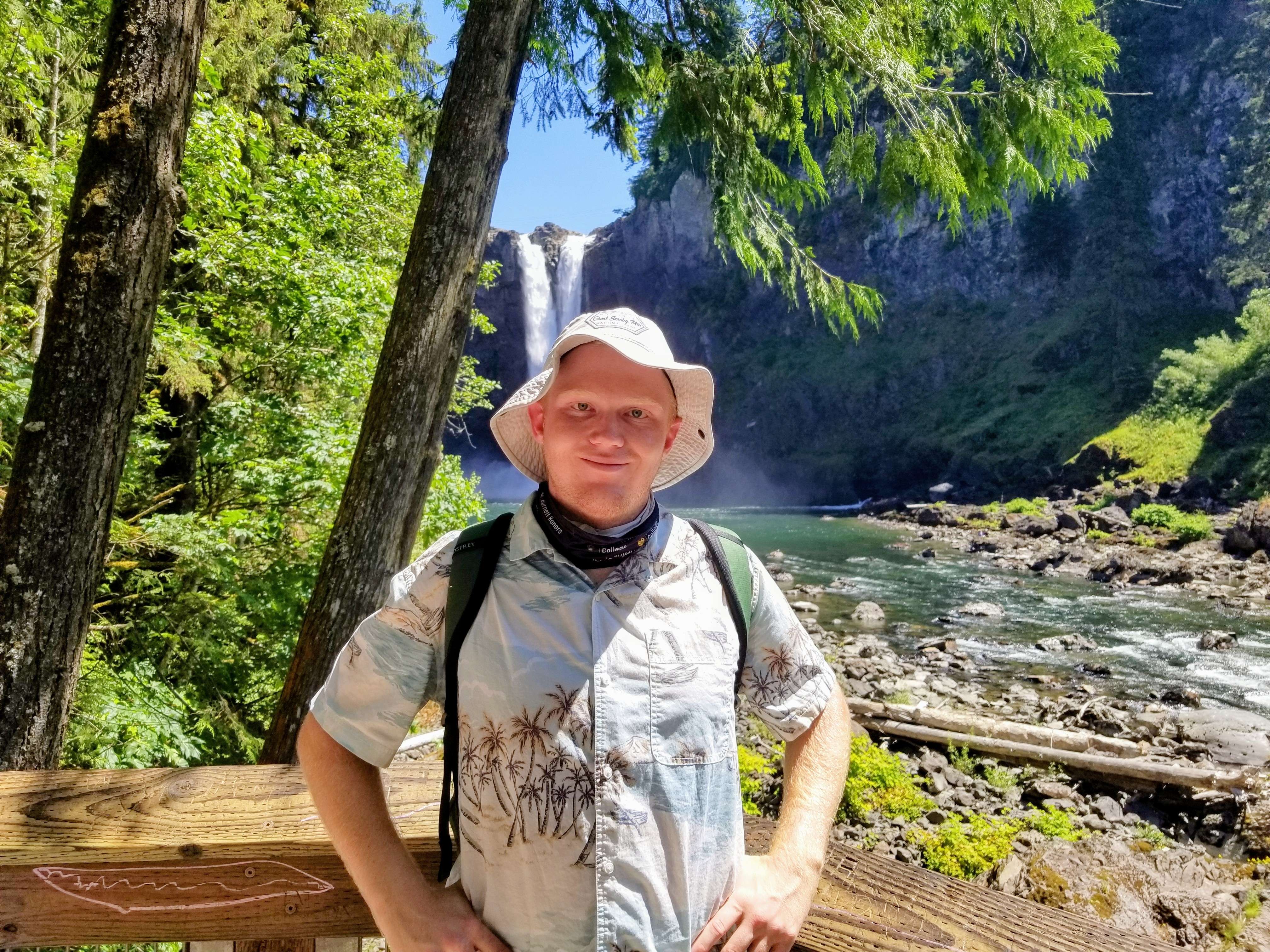 Photo of myself in front of a waterfall.